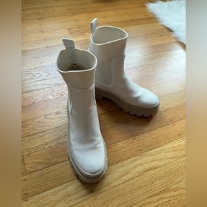 Cream sock boots.
